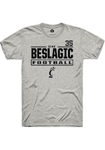 Dino Beslagic Cincinnati Bearcats Ash Football NIL Stacked Box Short Sleeve Player T Shirt